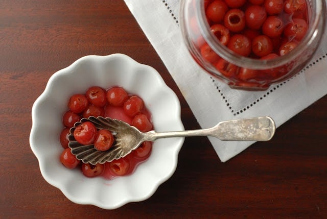 Homemade Maraschino Cherries in white bowl with spoon