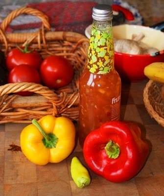 Food on a table, with Peppers and Sauce