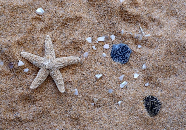 sand and pirate trinkets