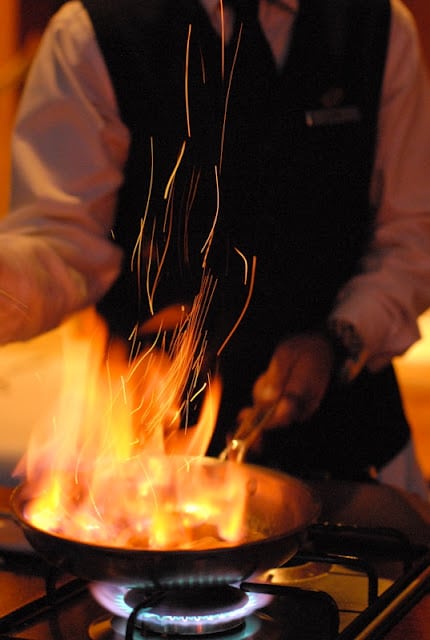 Chef cooking Bananas Foster with high flames