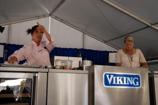 A woman standing in a kitchen