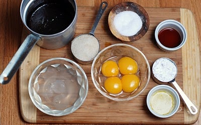 A bowl of food sitting on top of a wooden table