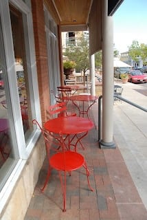 A chair sitting in front of a building