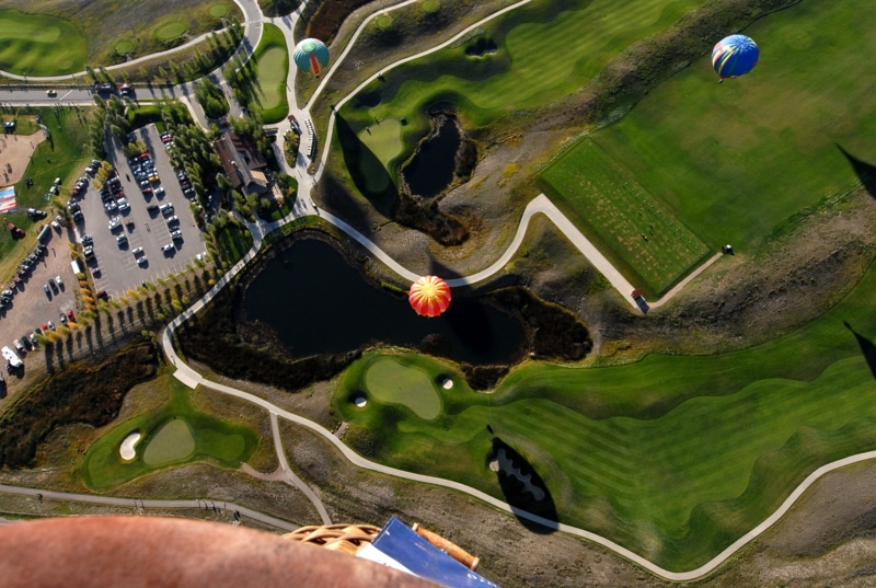 Looking down on hot air balloons