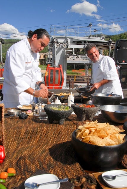 chefs preparing food in a parking lot