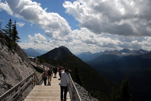 A man standing in front of a mountain-Fairmont Banff Springs