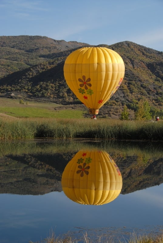 A large yellow balloon in the sky