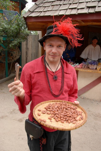 Renaissance festival player with food