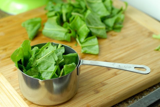 chopped sorrel in measuring cup