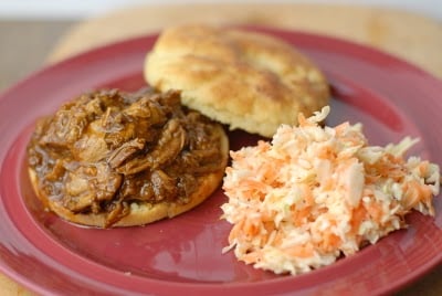 A plate of food, with Cabbage and Pulled pork