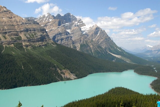 A view of a snow covered mountain with Peyto Lake in the background