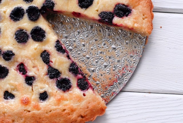 A close up of a slice of raspberry tart