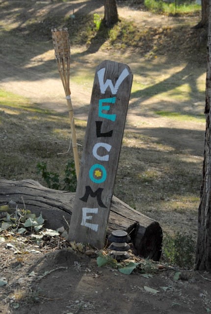 Painted welcome sign at farm
