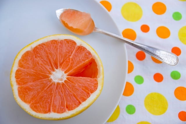 half grapefruit with spoon