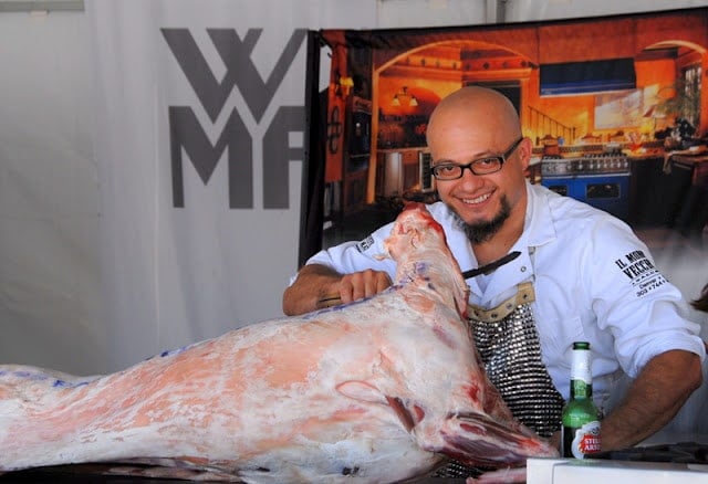 A man carving meat