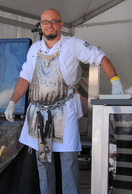 A man standing in a kitchen with tools