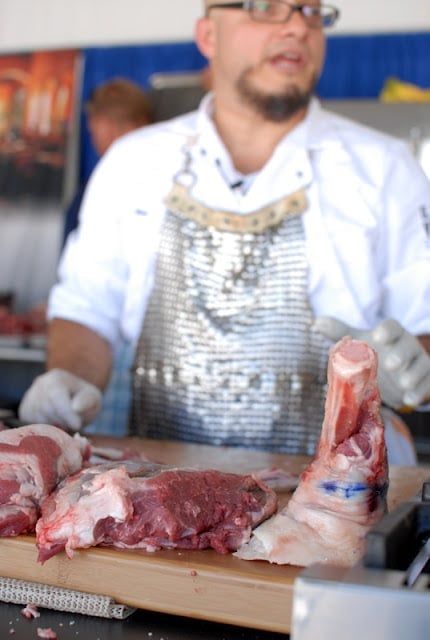 chef demonstrating meat carving