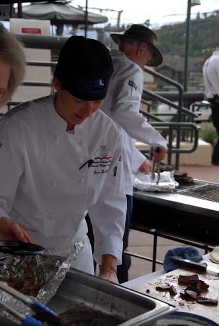 A group of people preparing food inside of it, with Chef and Art