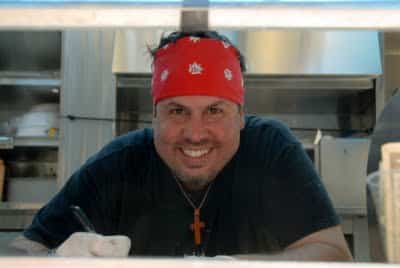 A man preparing food in a kitchen