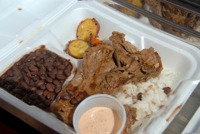 cooked meat, rice, beans and plantains