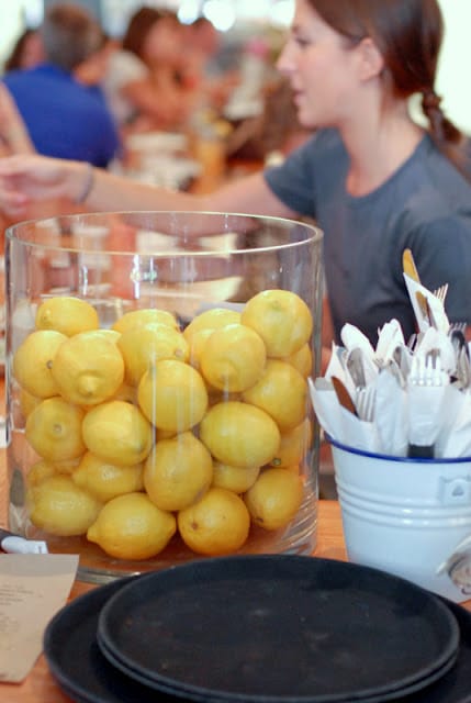 A group of people sitting at a table full of food