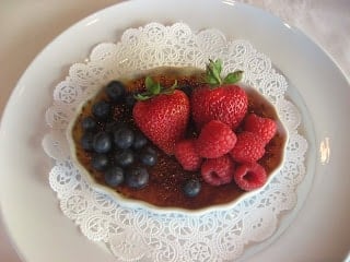 A bowl of fruit on a plate