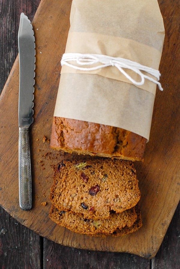Pumpkin Roasted-Banana Quick Bread overhead with slices and knife