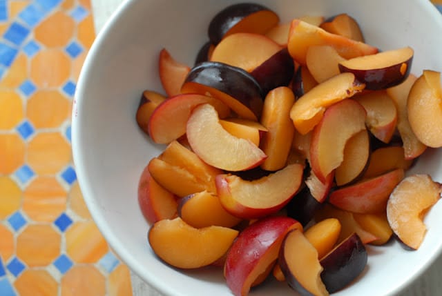 bowl of sliced plums