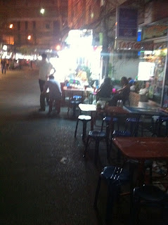 A group of people on a city street Bangkok