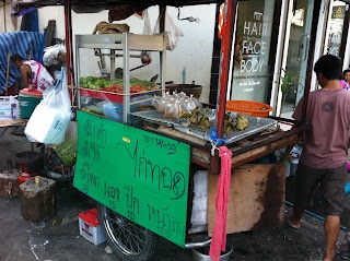 A person standing in front of a store