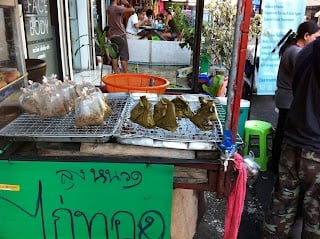 A person standing in front of a store