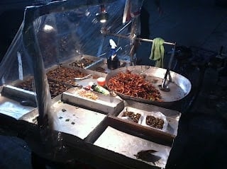 A tray of food on a grill, with Street food