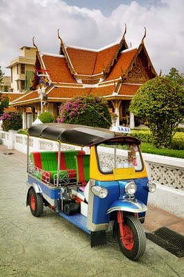 tuktuk parked in front of a house