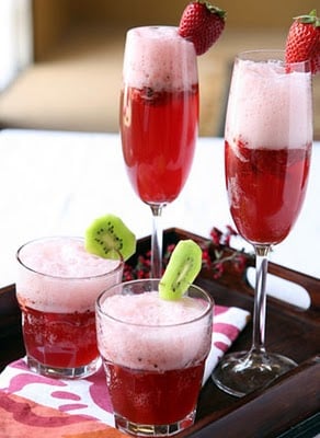 A glass of wine, with Strawberry and Champagne