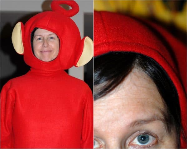 A person wearing teletubby costume