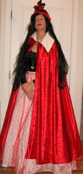 A woman wearing queen of hearts costume