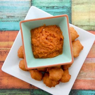A tray of food on a table, with Fritter and Akara