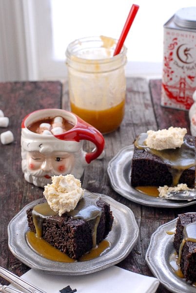 Servings of gingerbread cake with butter rum toffee sauce and whipped cream