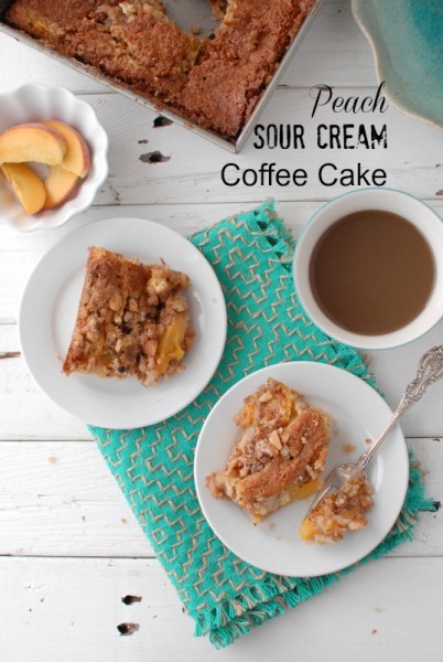 Peach Sour Cream Coffee Cake pieces on white plates