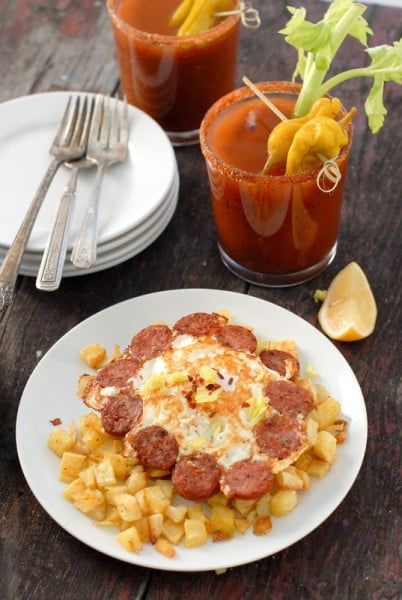cooked eggs with sausage and bloody mary