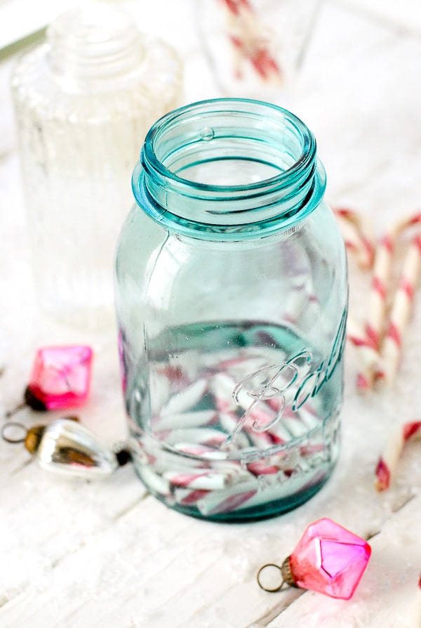 candy cane infused vodka in blue Mason jar