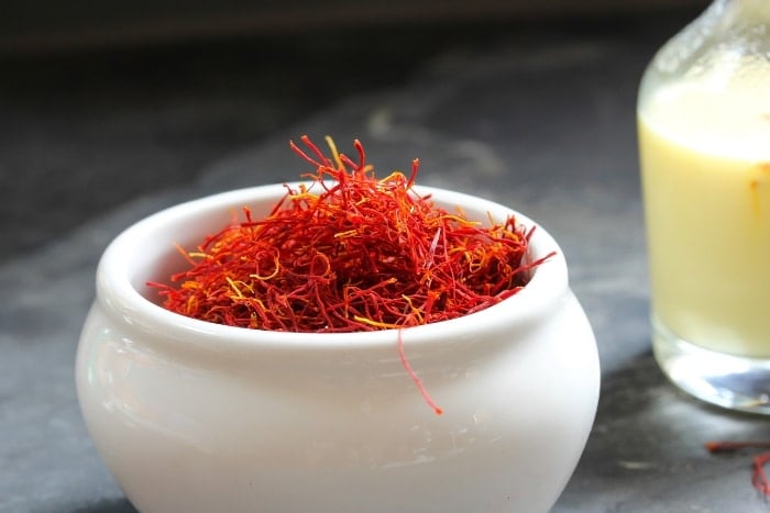 saffron threads in white bowl