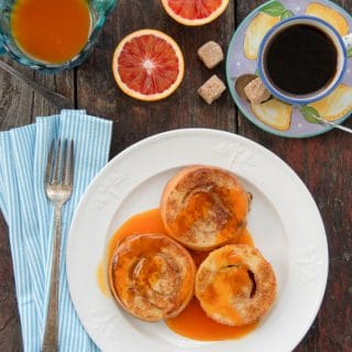 Cinnamon Roll French Toast with Satsuma-Vanilla Syrup on a white plate