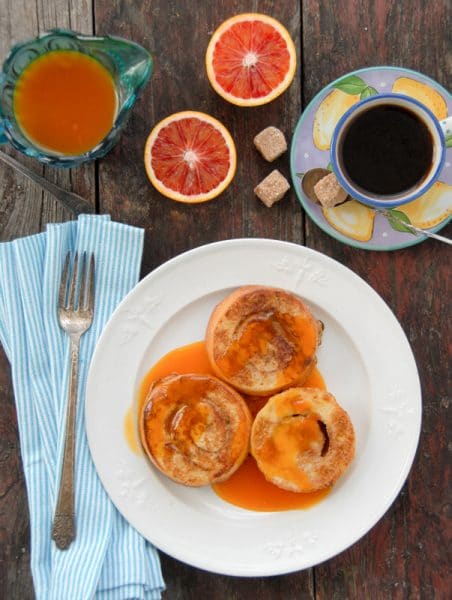 Cinnamon Roll French Toast with Satsuma-Vanilla Syrup on a white plate