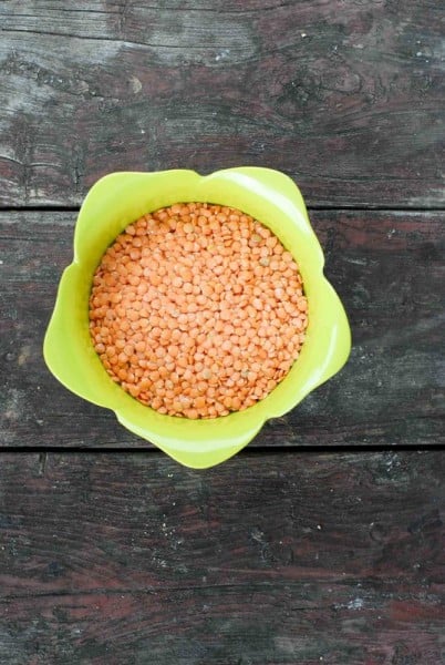 Red lentils in a green colander