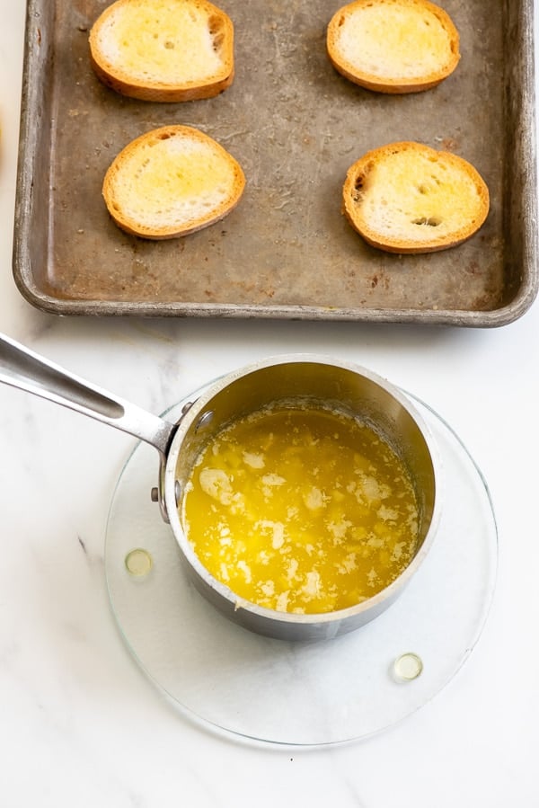 Homemade garlic butter and garlic toast rounds