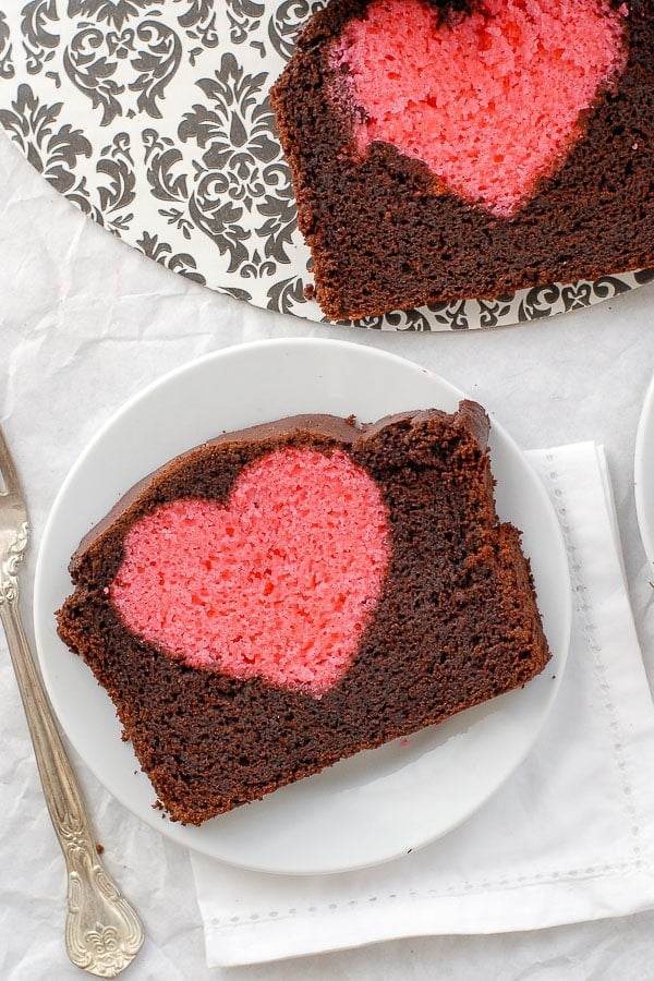 chocolate pound cake with pink cake heart in middle