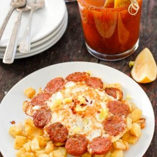 A close up of a plate of food and a cup of coffee, with Egg and Bloody Mary