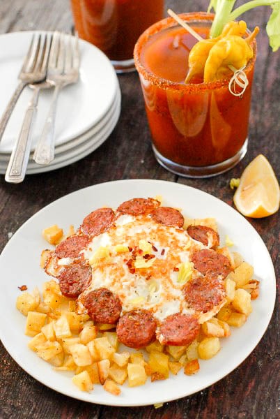 A close up of a plate of food and a cup of coffee, with Egg and Bloody Mary