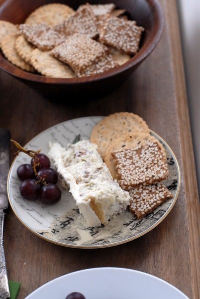Savory Blue Cheese Cake with red grapes gluten free crackers on plate